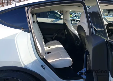 2023 Tesla Model Y Performance Dual Motor All-Wheel Drive from USA, damaged, VIN 7SAYGDEF6PF665311